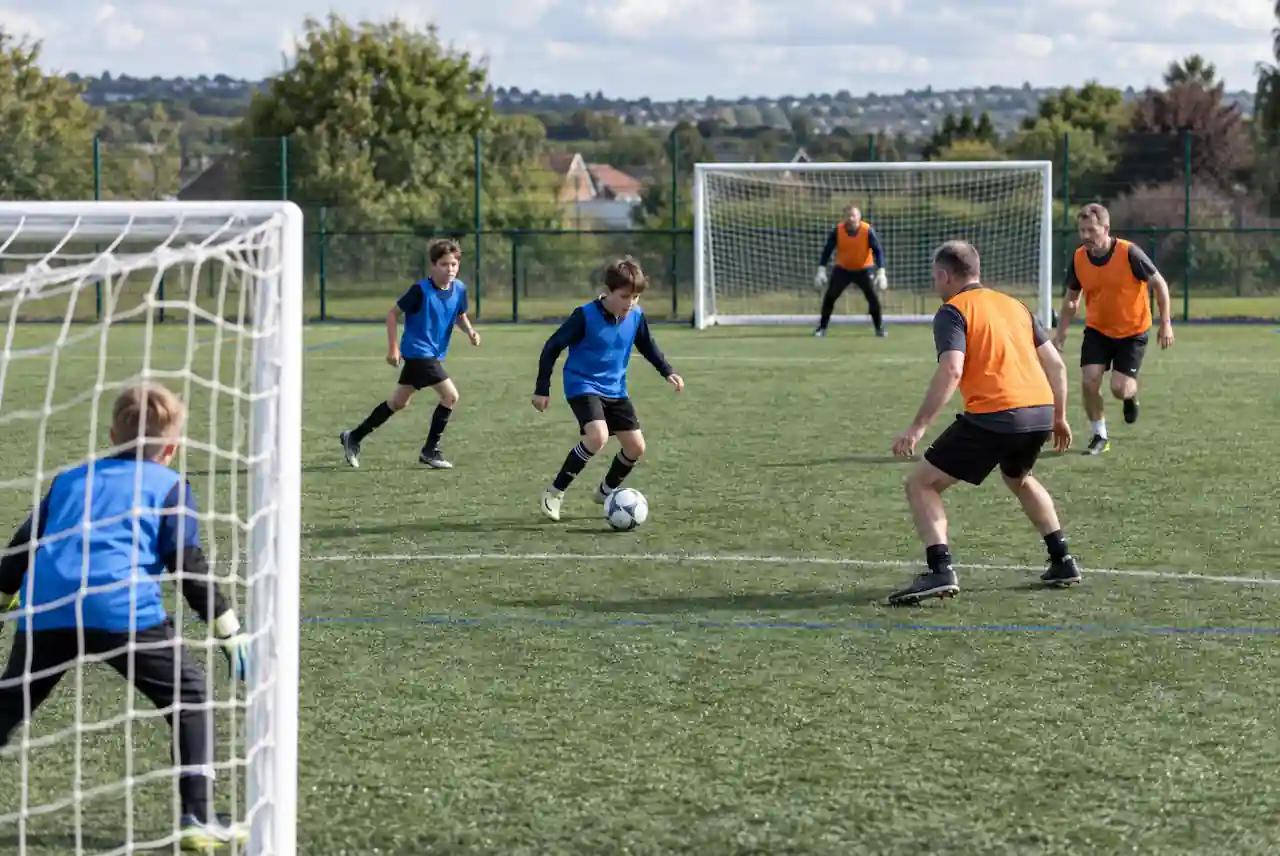 parents versus kids football team end of season match