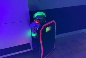 Children enjoying UV Nerf party games with glowing equipment